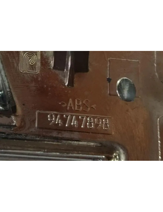 Emblema Parachoque Dianteiro Onix Joy 2013 - 2018 Prateado